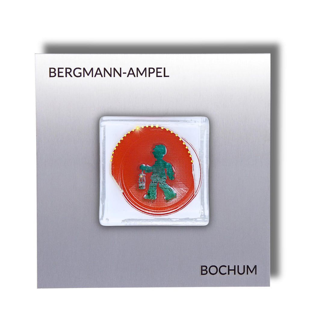 Edition 1/12. Pott Glas Wand-Potträt mit Bergmannsampel-Motiv in Grün. Foto in Schmelzglas auf Edelstahl. Quadratisches Format mit Gravur „Bergmann-Ampel Bochum“.