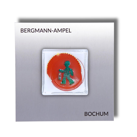 Edition 1/12. Pott Glas Wand-Potträt mit Bergmannsampel-Motiv in Grün. Foto in Schmelzglas auf Edelstahl. Quadratisches Format mit Gravur „Bergmann-Ampel Bochum“.