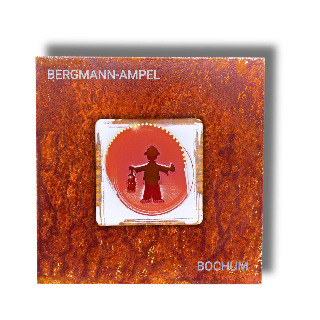Edition 1/12. Pott Glas Wand-Potträt mit Bergmannsampel-Motiv in Rot. Foto in Schmelzglas auf Roststahl. Quadratisches Format mit Gravur „Bergmann-Ampel Bochum“.