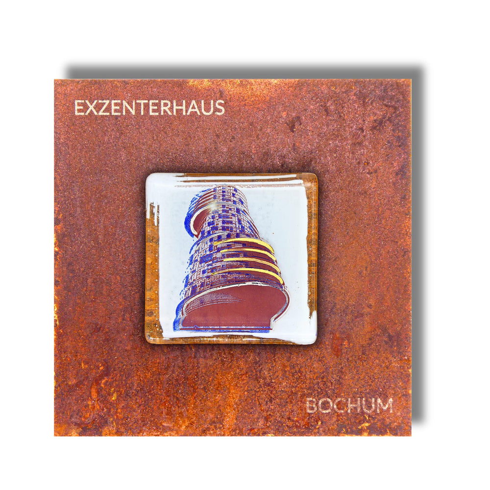 Edition 2/12. Pott Glas Wand-Potträt mit blauem Exzenterhaus-Motiv. Foto in Schmelzglas auf Roststahl. Quadratisches Format mit Gravur „Exzenterhaus Bochum".